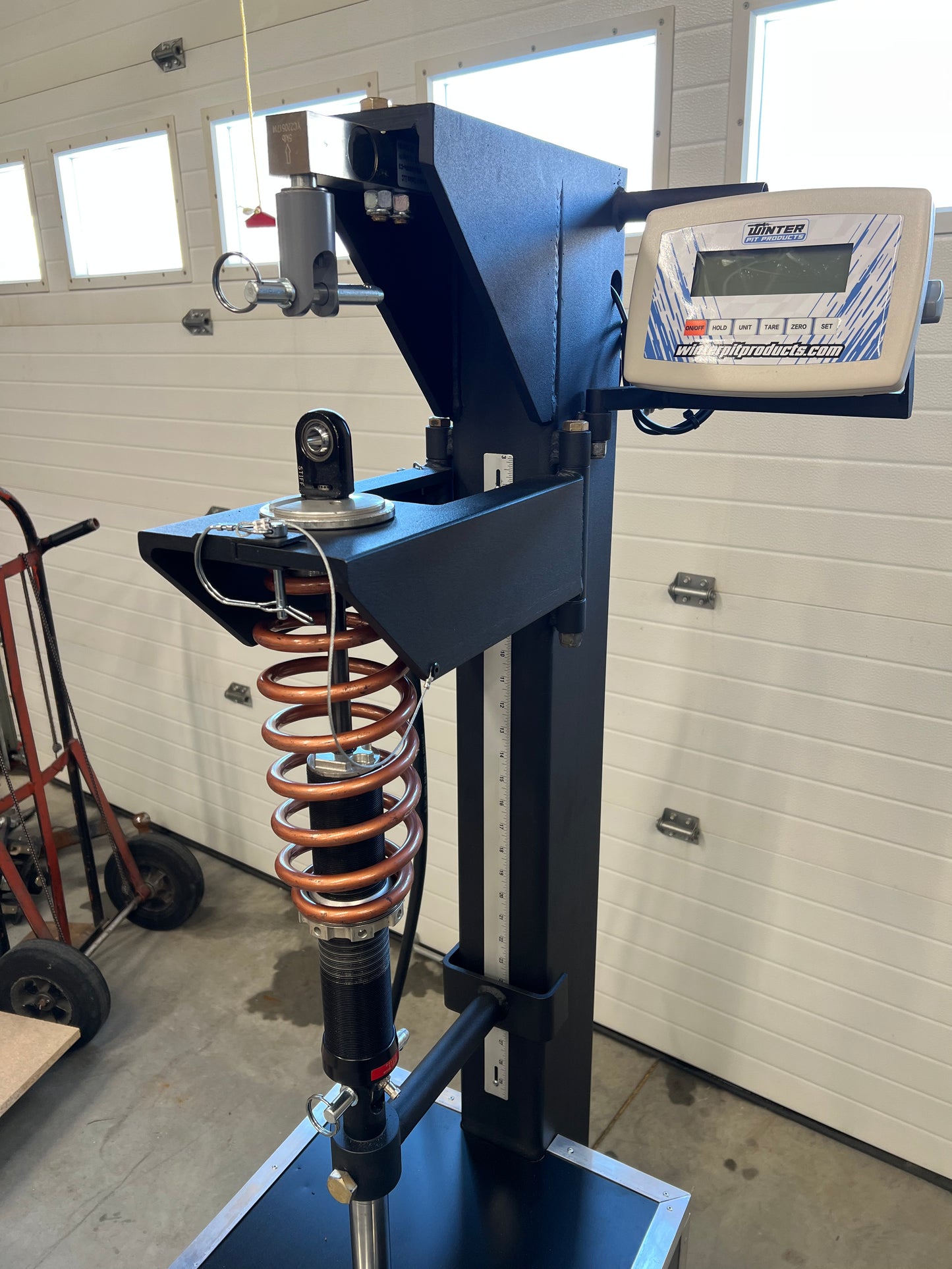 Coil-Over Commander Load Machine