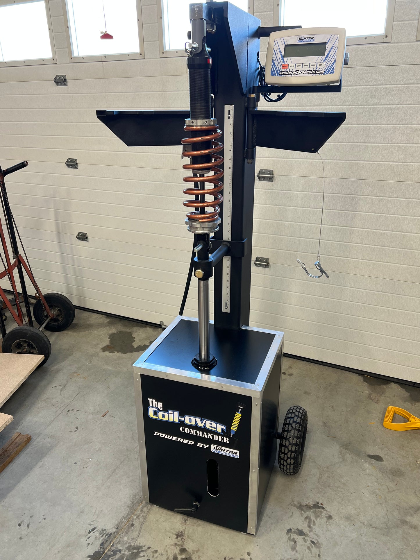 Coil-Over Commander Load Machine